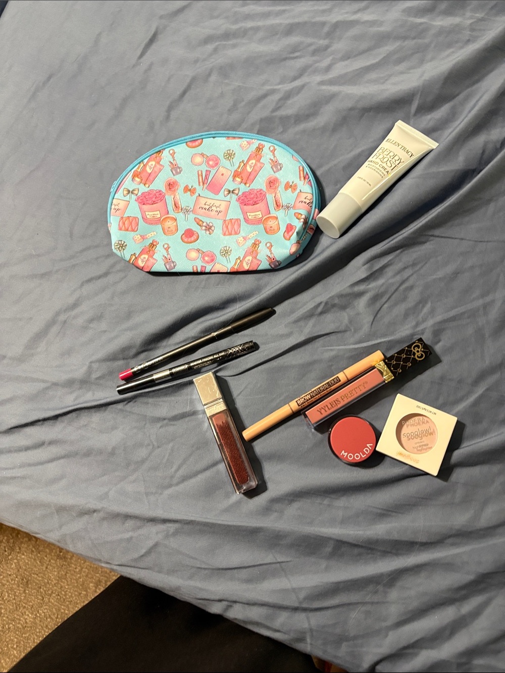 Blue Cosmetic Makeup Bag with Fun Print and assorted make up. - Picture 15 of 16
